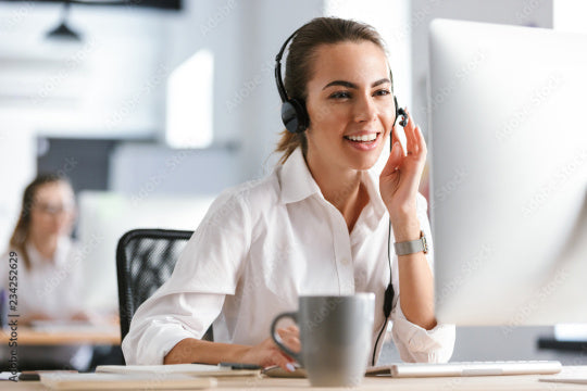 Kegel8 support advisor wearing a headset at a desk