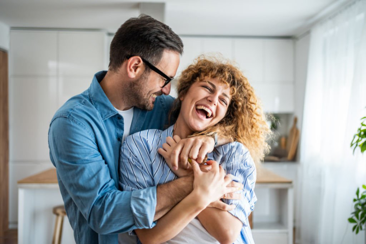 Woman relaxing at home, representing pelvic floor confidence and well-being