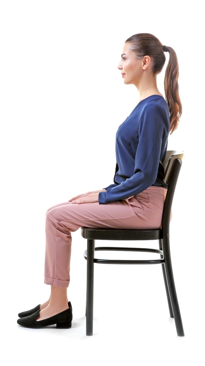When sitting, remember to put your bum at the back of your chair; lengthen your spine and again, maintain that natural inward curve at your lower spine